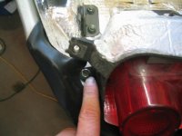 Bolt in tail light with 2 10mm nuts.JPG