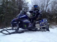 Doug-Henry-snowmobile-side-shot-with-gear-690x517.jpg