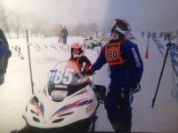 Kirk and Kirsten shareing the Phazer in sno cross, wating to run there class.jpg